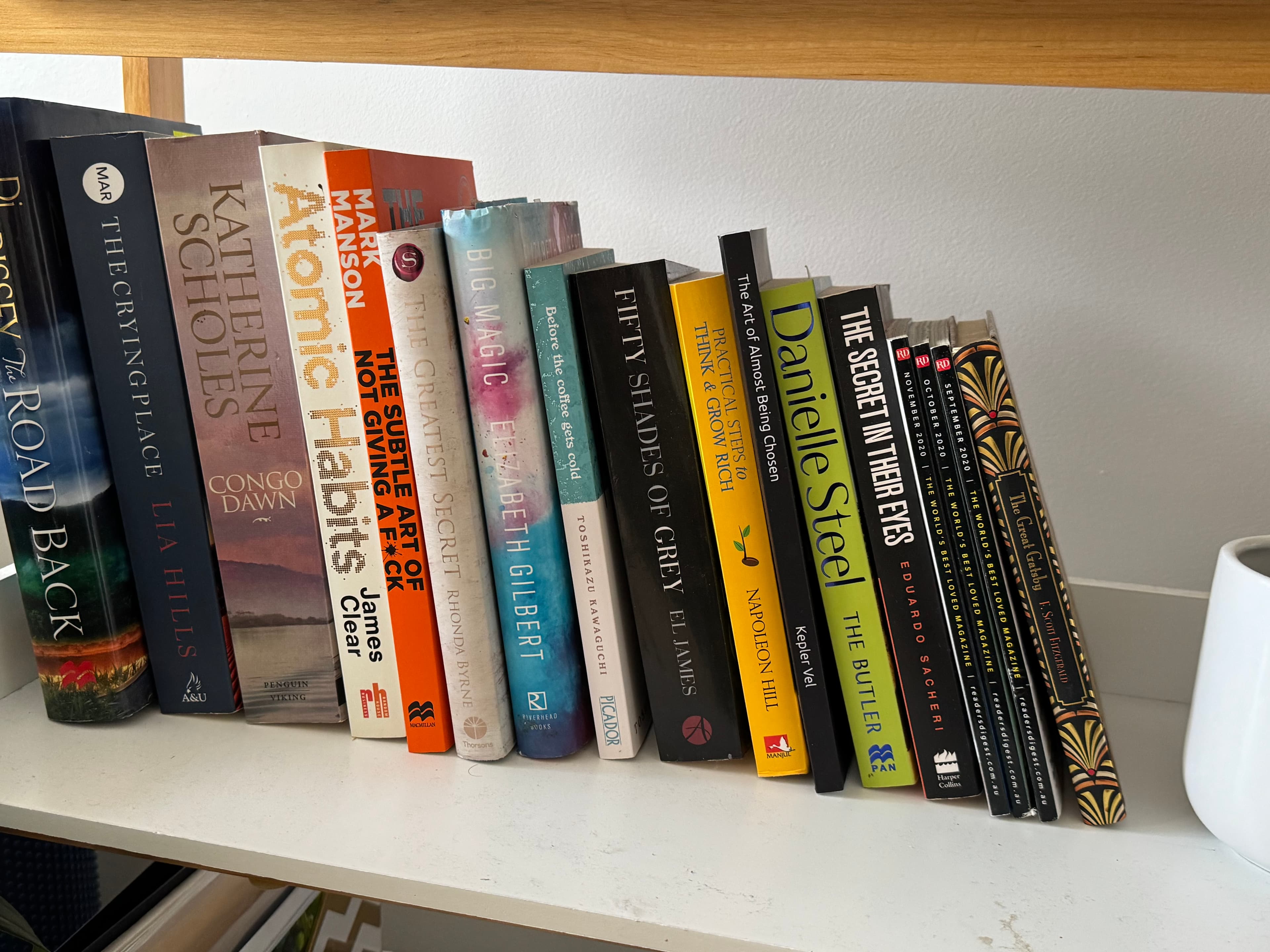 The book on a shelf beside Atomic Habits, Big Magic, The Subtle Art of Not Giving a F*ck and other bestsellers
